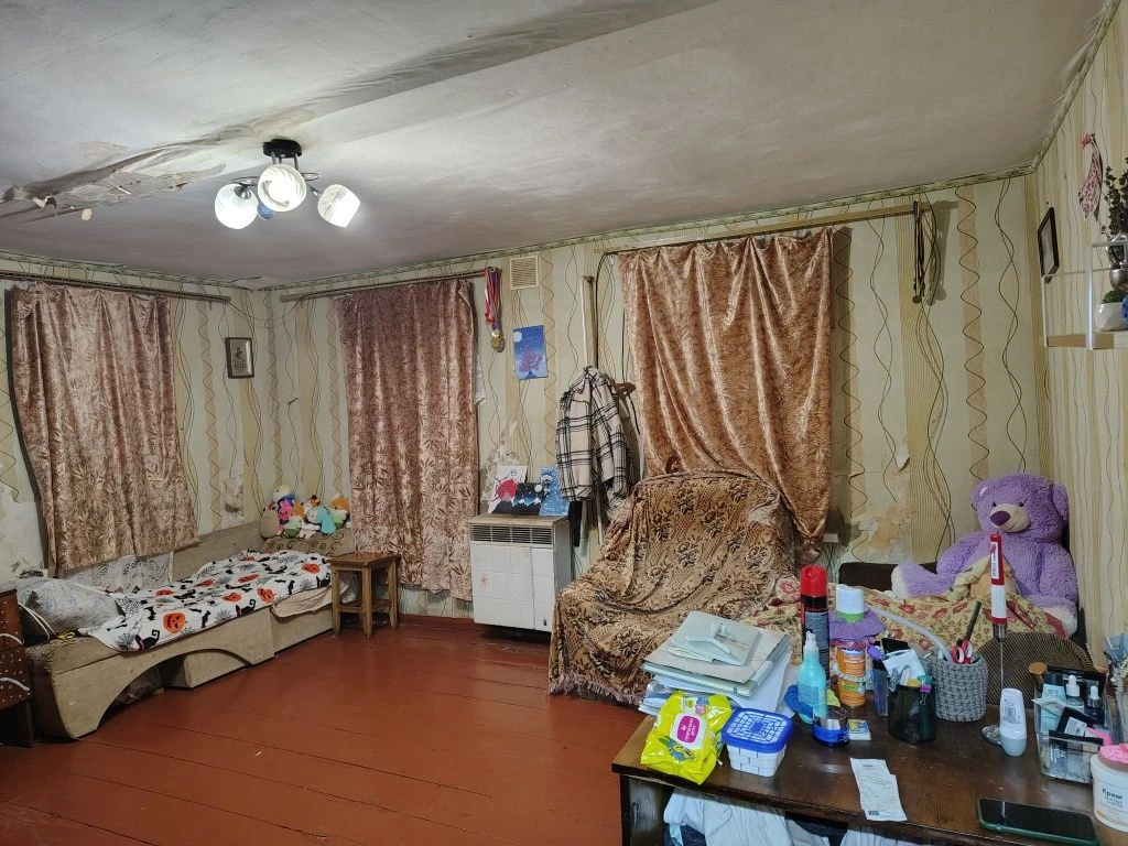 Продам 1/2 будинку поруч з центром Мерефи.