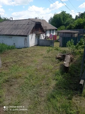Земельна ділянка з будинком та прибудовами