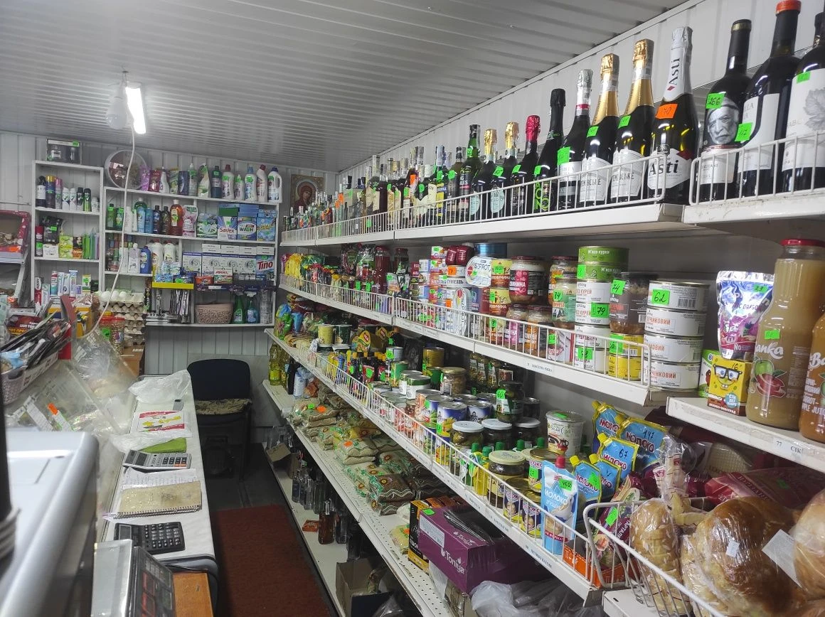 Продам земельный участок , и действующий  магазин.