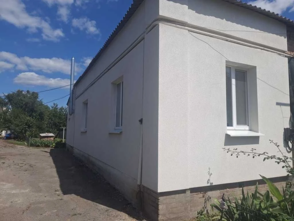 Продам частину будинку з гаражем у центральній частині міста