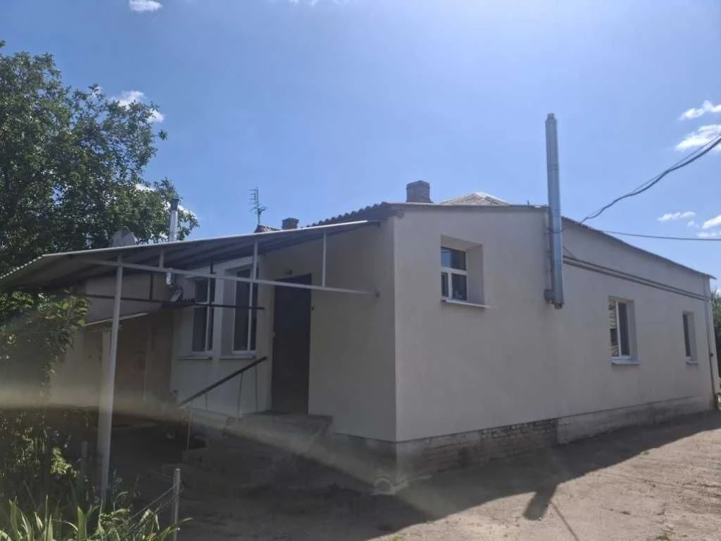 Продам частину будинку з гаражем у центральній частині міста