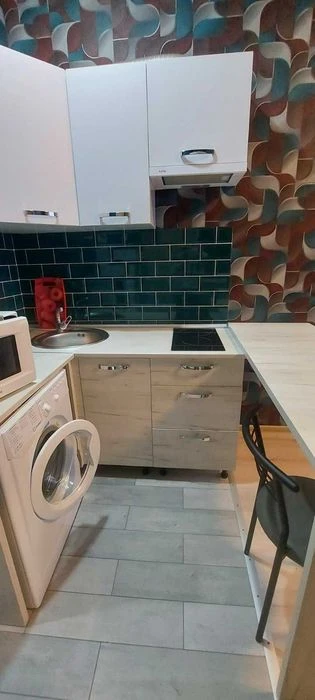 I am selling a small hotel room near the French Boulevard shopping center.