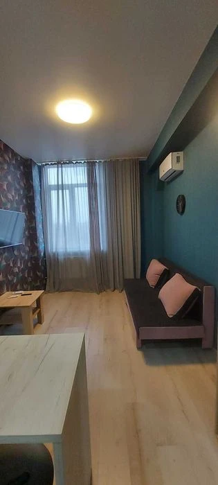I am selling a small hotel room near the French Boulevard shopping center.