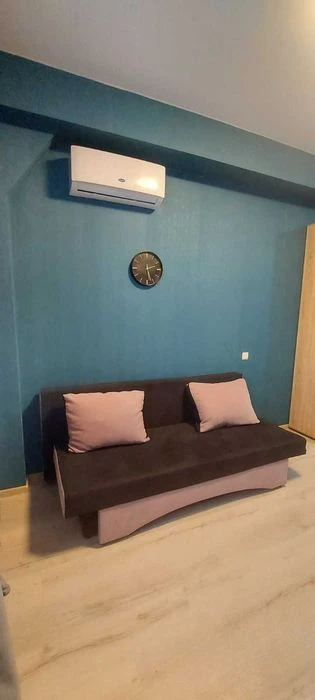 I am selling a small hotel room near the French Boulevard shopping center.