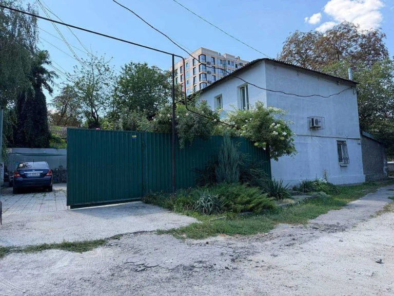 Buy an apartment with a private yard and parking in the center