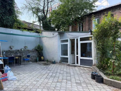 Buy an apartment with a private yard and parking in the center