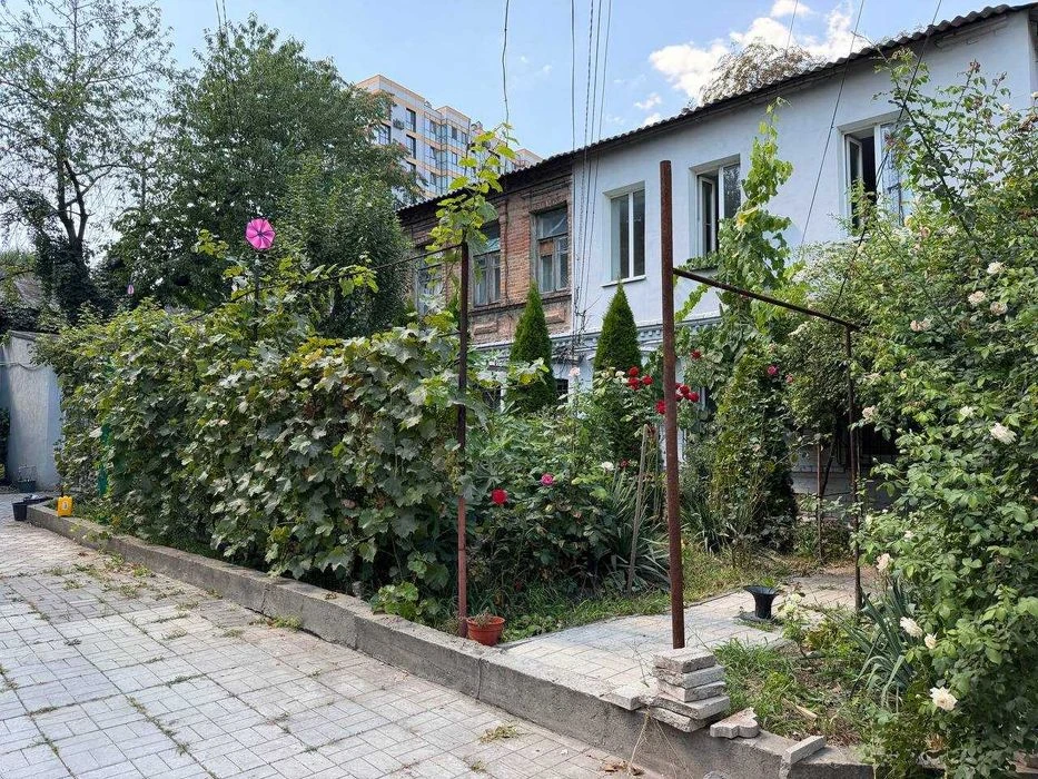 Buy an apartment with a private yard and parking in the center