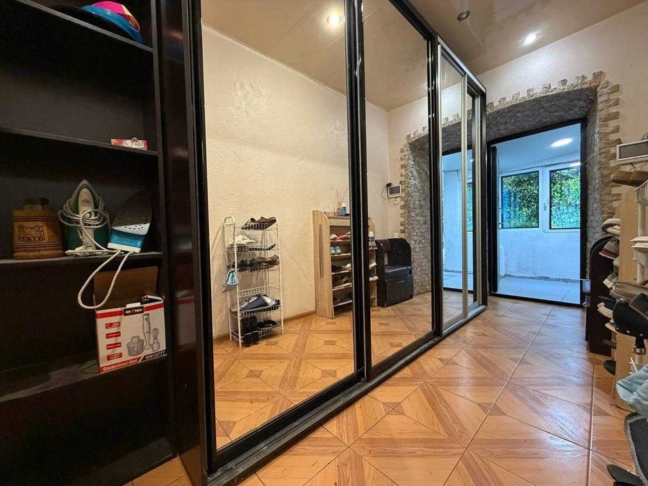 Buy an apartment with a private yard and parking in the center