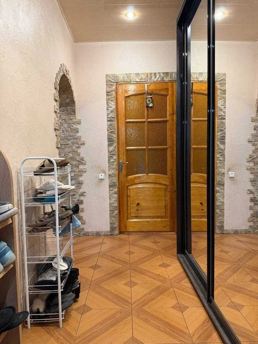 Buy an apartment with a private yard and parking in the center