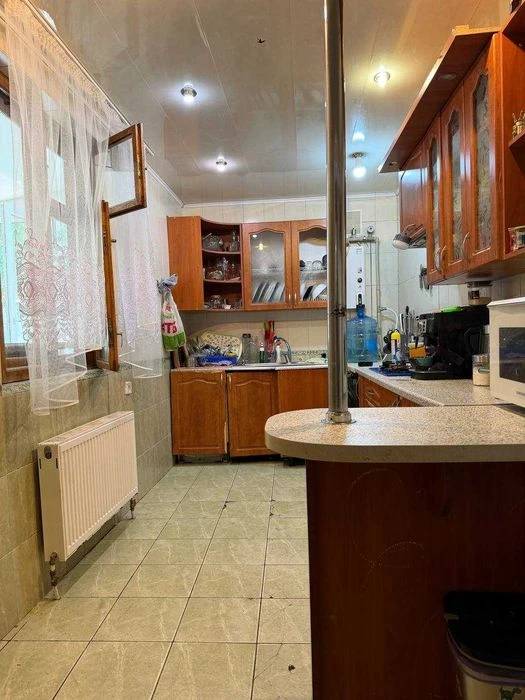 Buy an apartment with a private yard and parking in the center