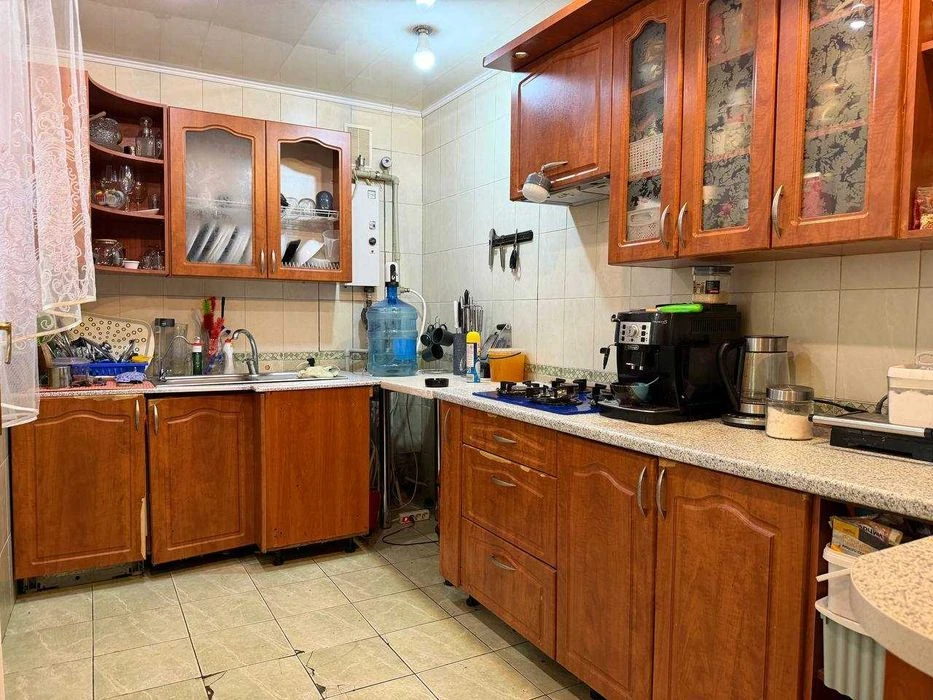 Buy an apartment with a private yard and parking in the center