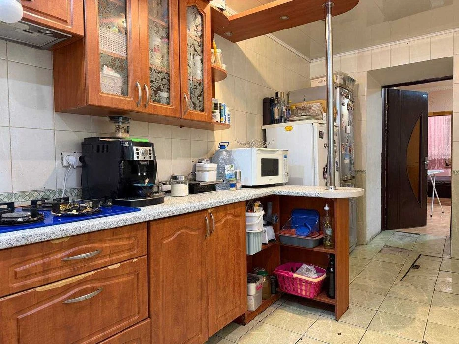 Buy an apartment with a private yard and parking in the center