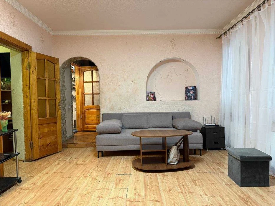 Buy an apartment with a private yard and parking in the center