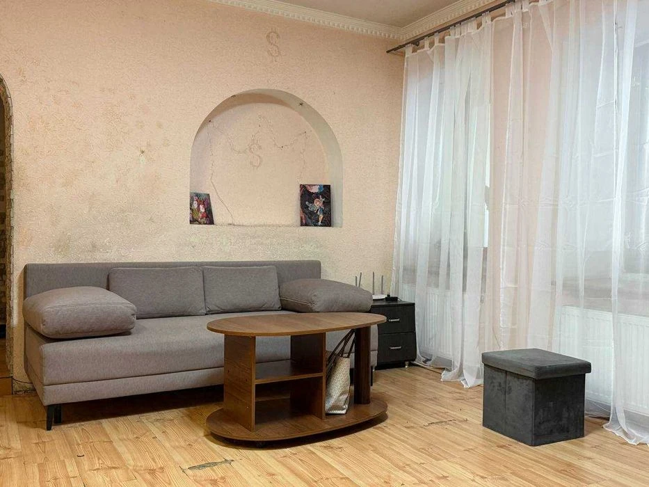 Buy an apartment with a private yard and parking in the center