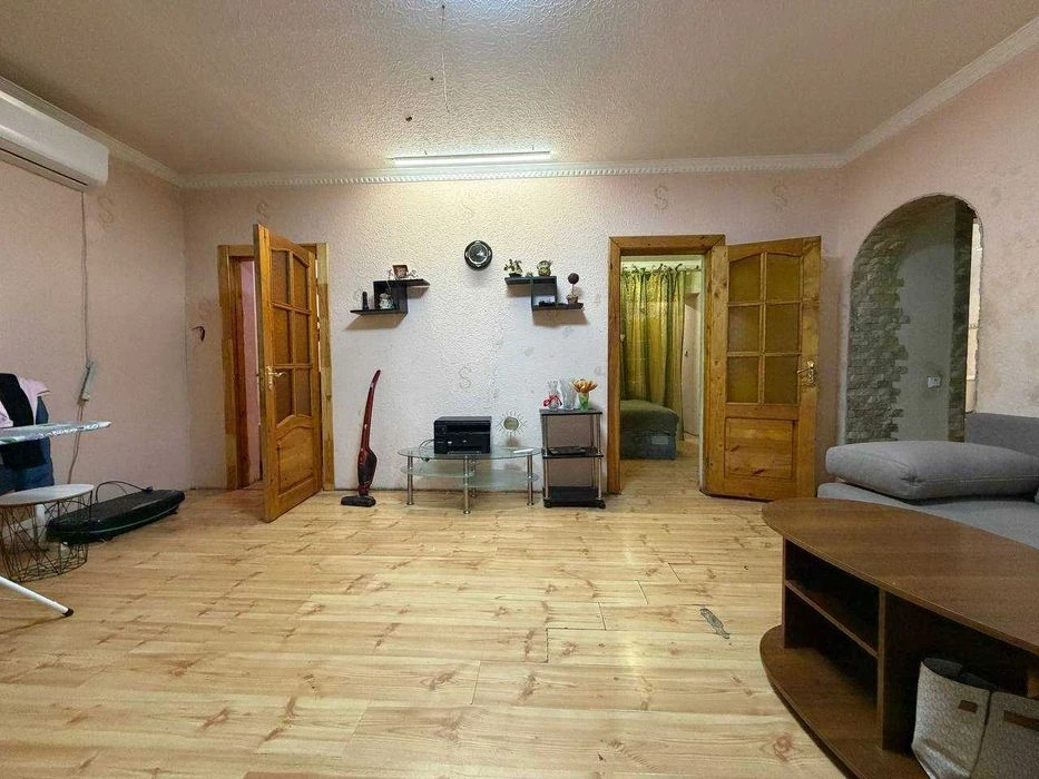 Buy an apartment with a private yard and parking in the center