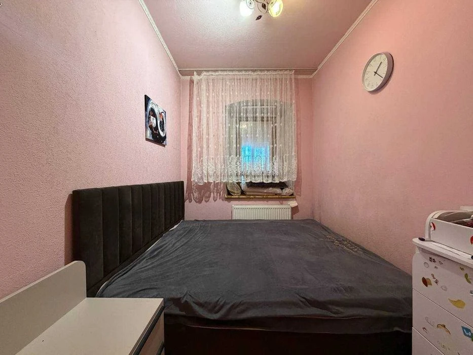 Buy an apartment with a private yard and parking in the center