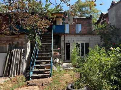 Buy an apartment with a private yard and parking in the center